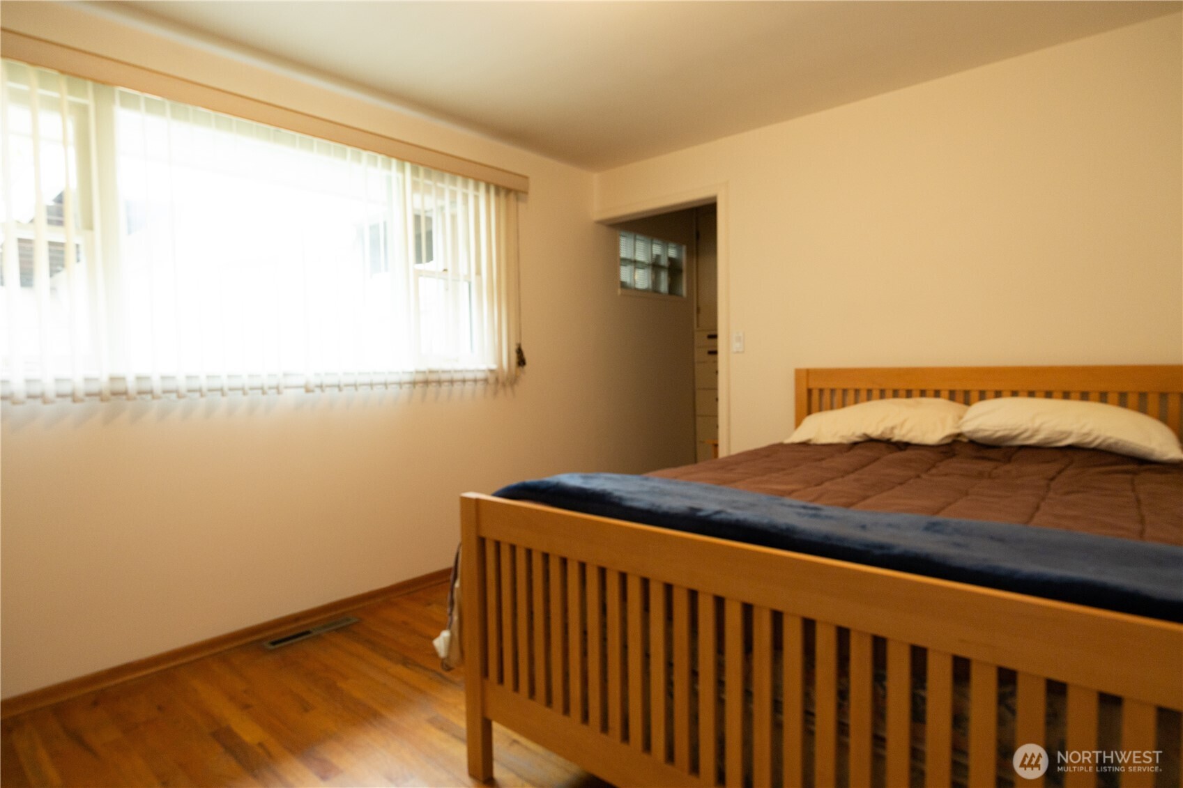 2105 100th Avenue Northeast Bellevue, WA 98004 - Photo 11 of 14 a bedroom with a bed and window