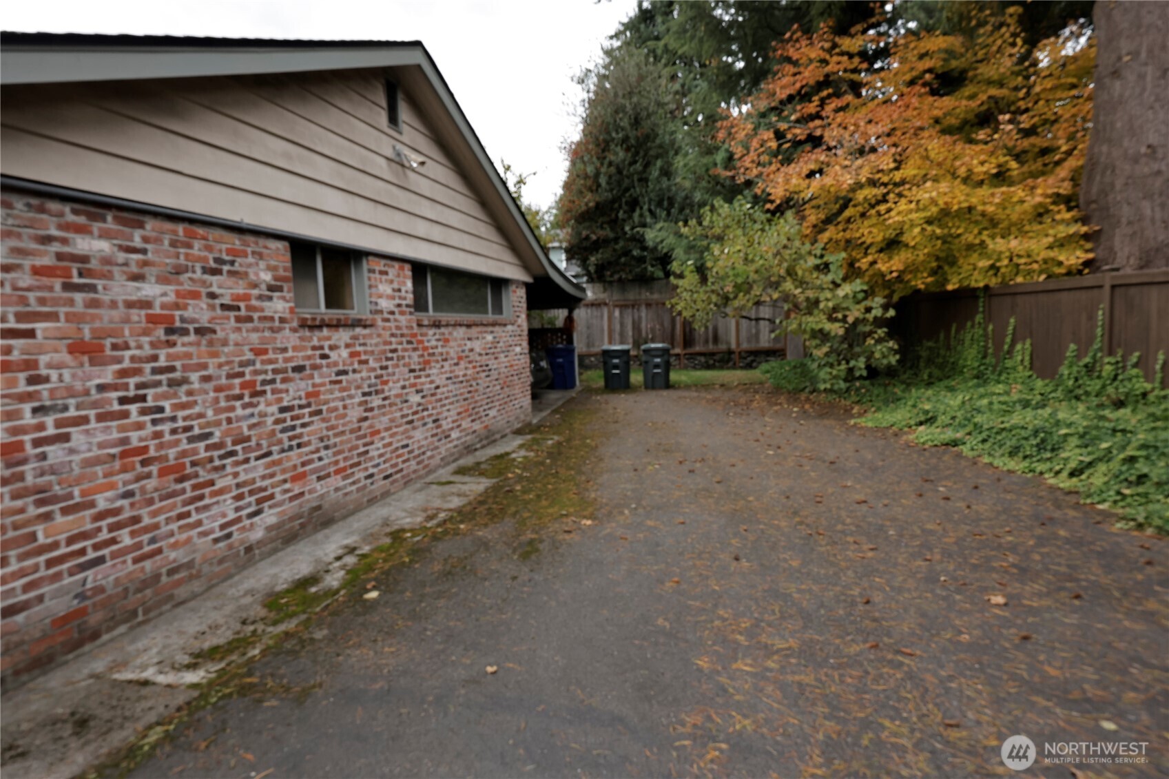 2105 100th Avenue Northeast Bellevue, WA 98004 - Photo 14 of 14 a brick house with a tree in front of it