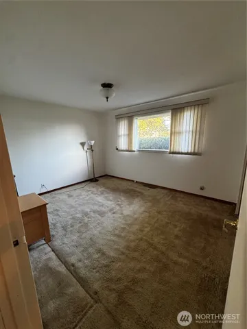 a brick house with a tree in front of it