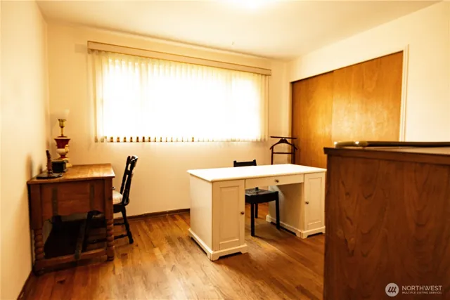 a view of a dining room with furniture window and wooden floor
