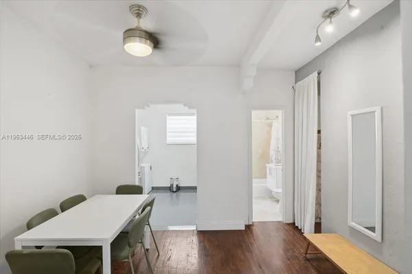 a view of a room with wooden floor windows and wooden floor