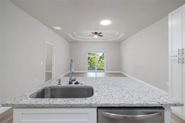 a kitchen with a sink and window