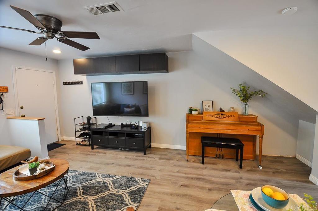 10155 Carefree Drive Santee, CA 92071 - Photo 5 of 19 a living room with furniture and a flat screen tv with wooden floor