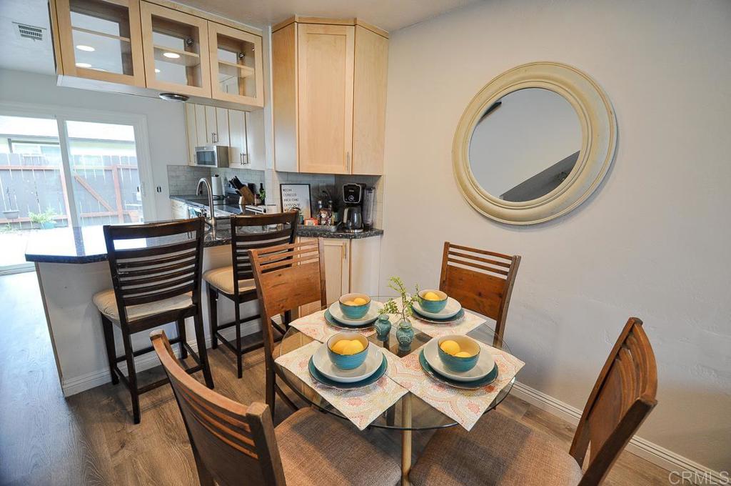 10155 Carefree Drive Santee, CA 92071 - Photo 6 of 19 a view of a dining room with furniture and wooden floor