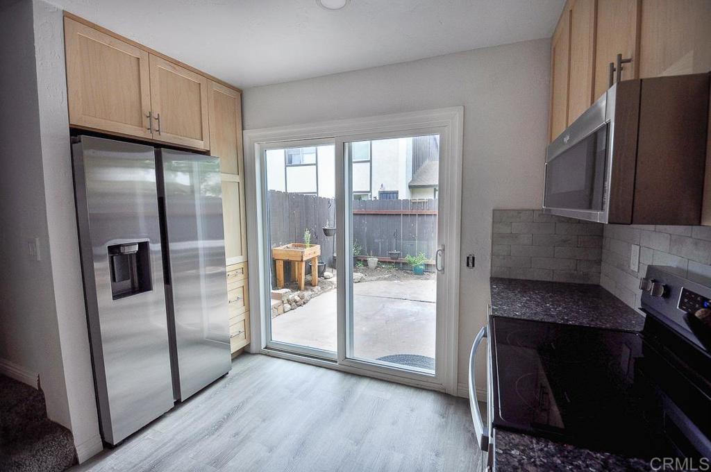 10155 Carefree Drive Santee, CA 92071 - Photo 8 of 19 a kitchen with stainless steel appliances granite countertop a refrigerator and a stove
