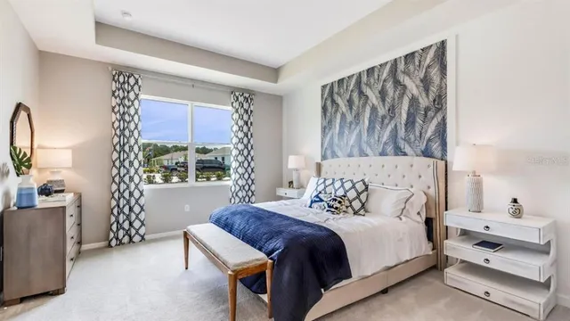 a bedroom with a bed and a couch