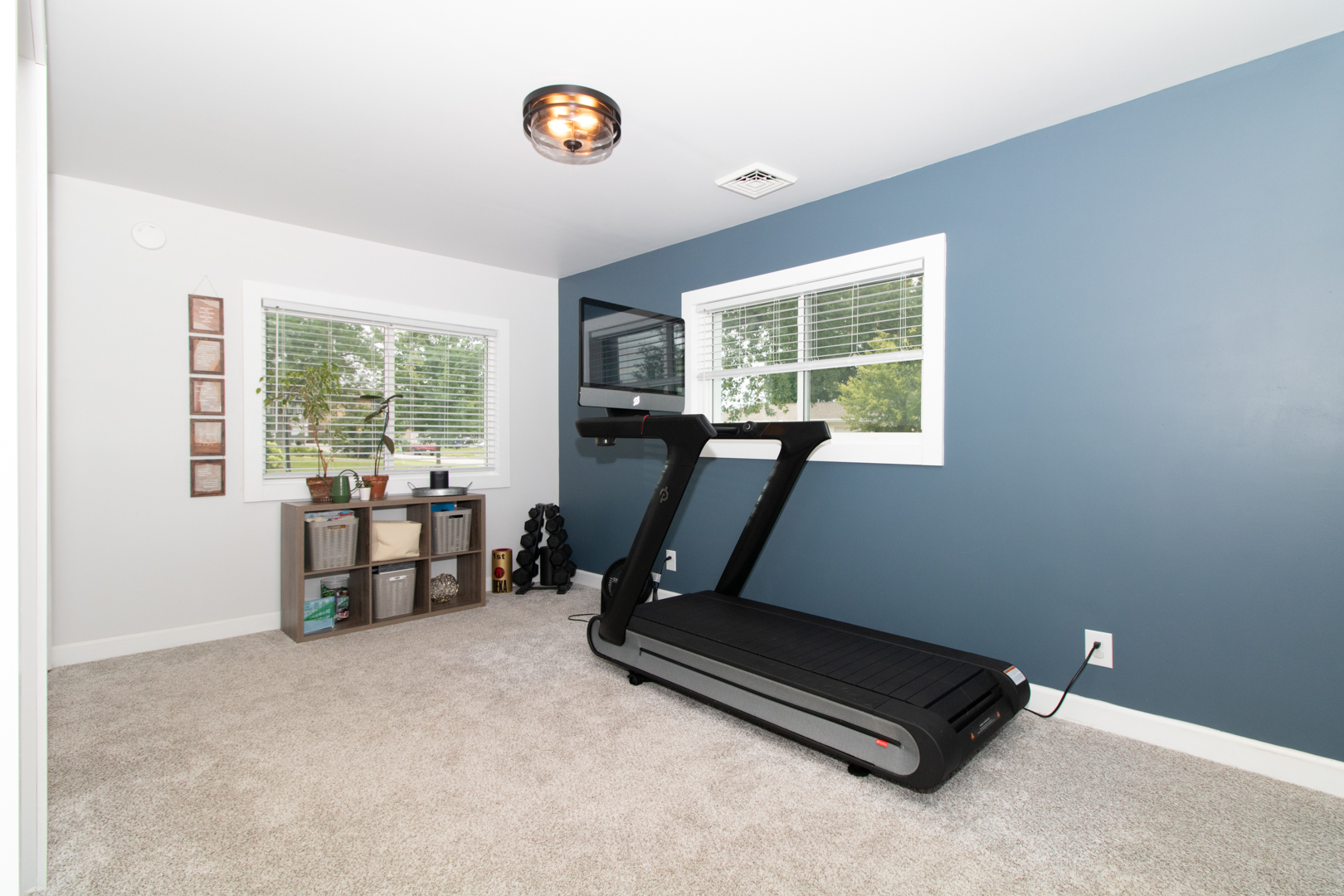 222 Ivanhoe Way Bloomington, IL 61701 - Photo 30 of 46 a room with gym equipment and a window