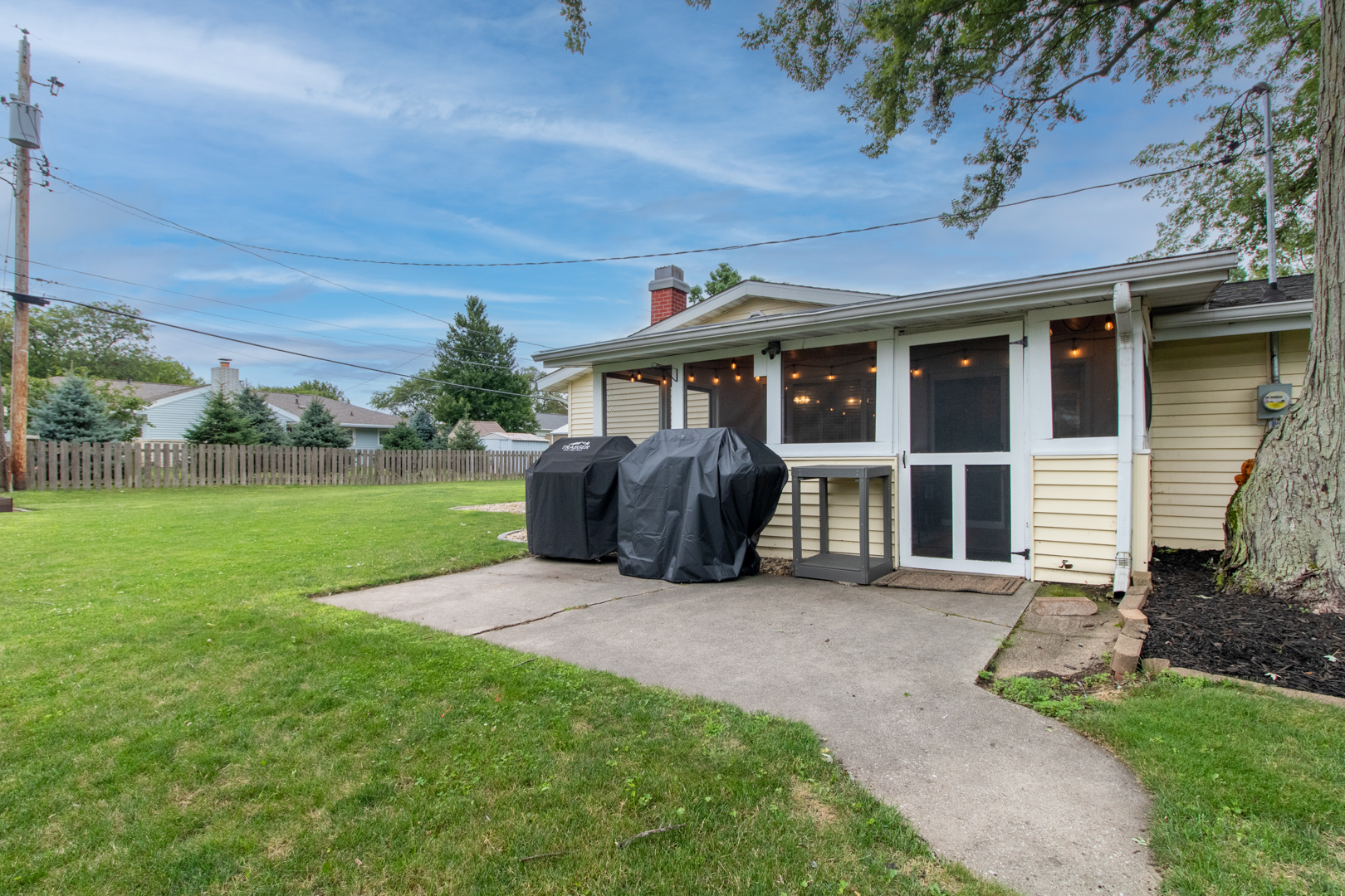 222 Ivanhoe Way Bloomington, IL 61701 - Photo 40 of 46 a view of a house with backyard and a garden