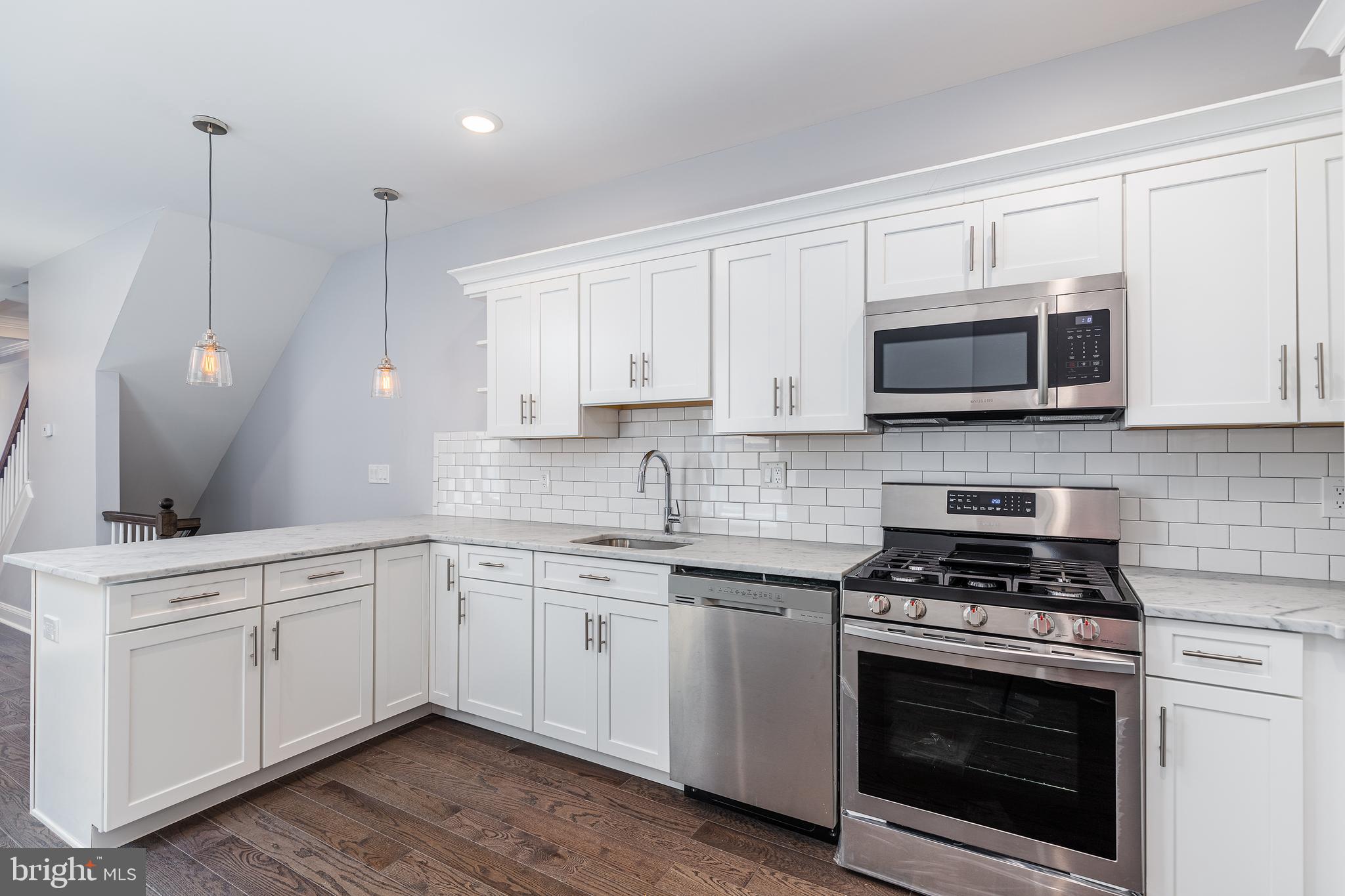 1701 Patapsco Street Baltimore, MD 21230 - Photo 13 of 52 a kitchen with appliances a sink and cabinets