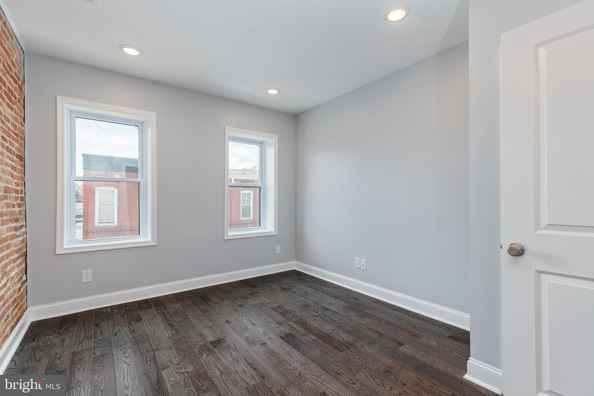 1701 Patapsco Street Baltimore, MD 21230 - Photo 16 of 52 a view of empty room with wooden floor and fan