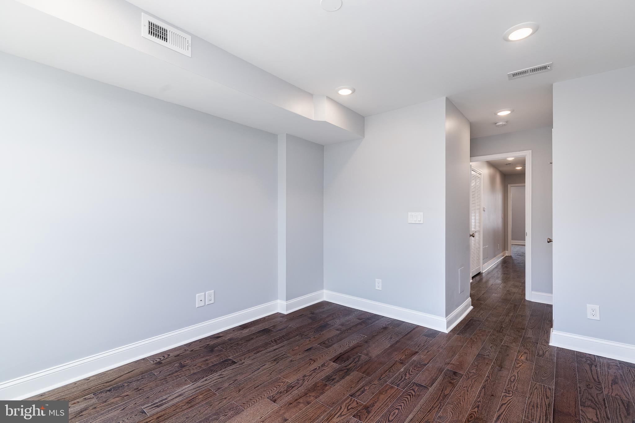 1701 Patapsco Street Baltimore, MD 21230 - Photo 23 of 52 a view of an empty room and wooden floor
