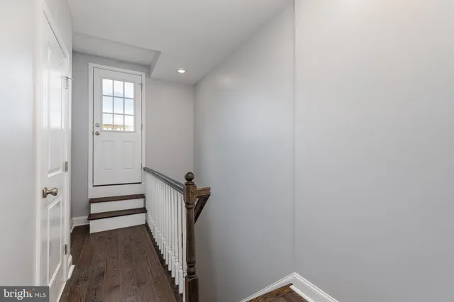 a view of a hallway with stairs