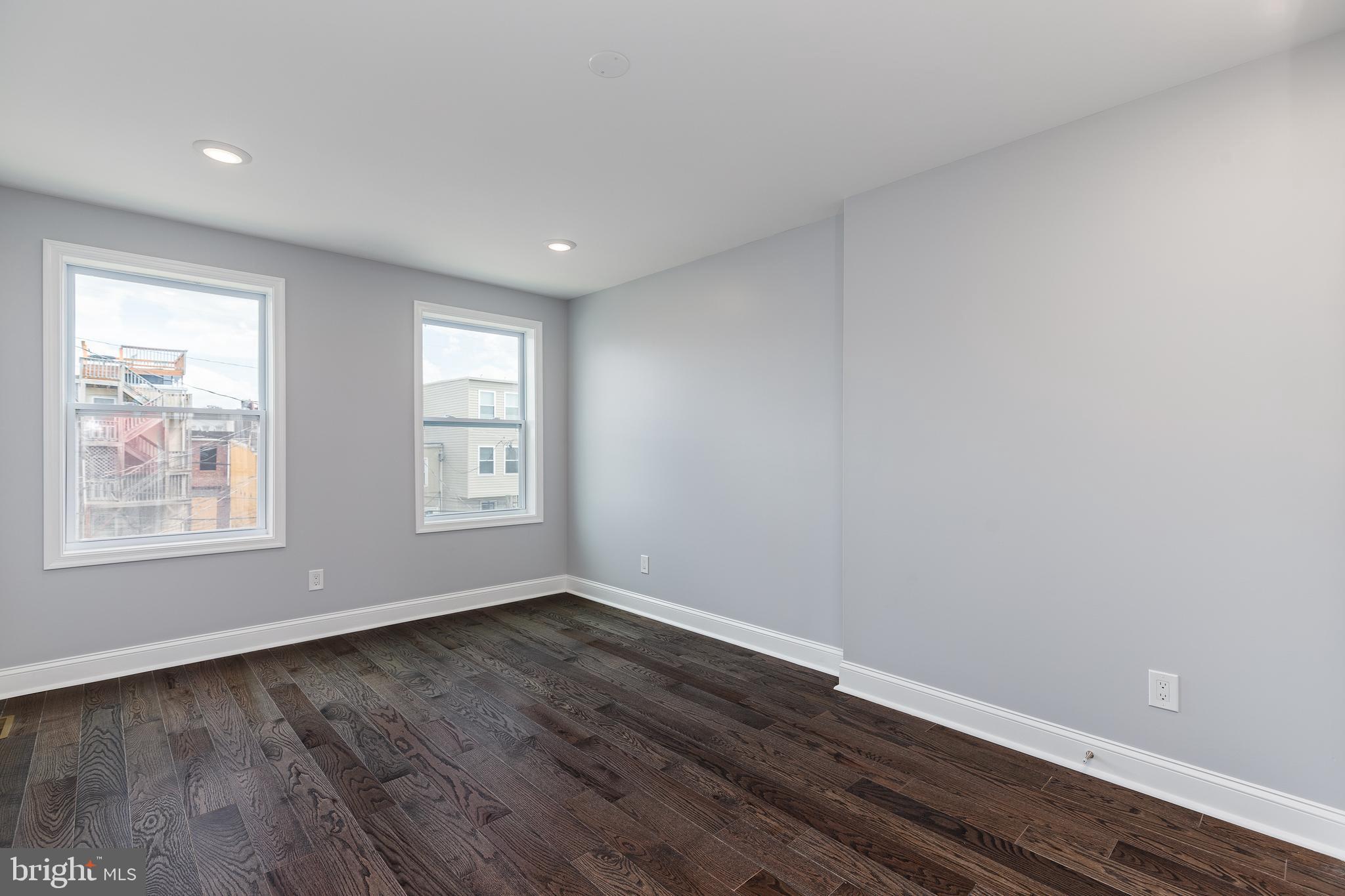 1701 Patapsco Street Baltimore, MD 21230 - Photo 29 of 52 a view of an empty room with wooden floor and a window