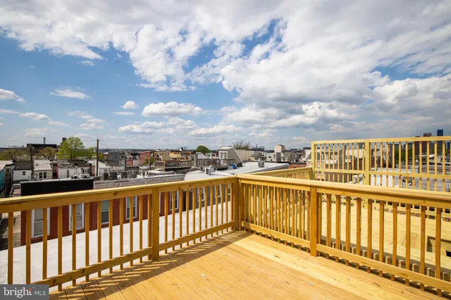a view of a balcony with wooden floor