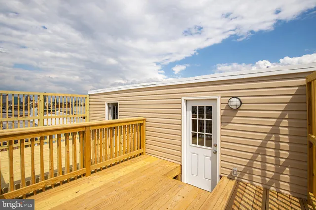 a view of a balcony with a barbeque