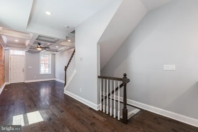 a view of entryway with wooden floor
