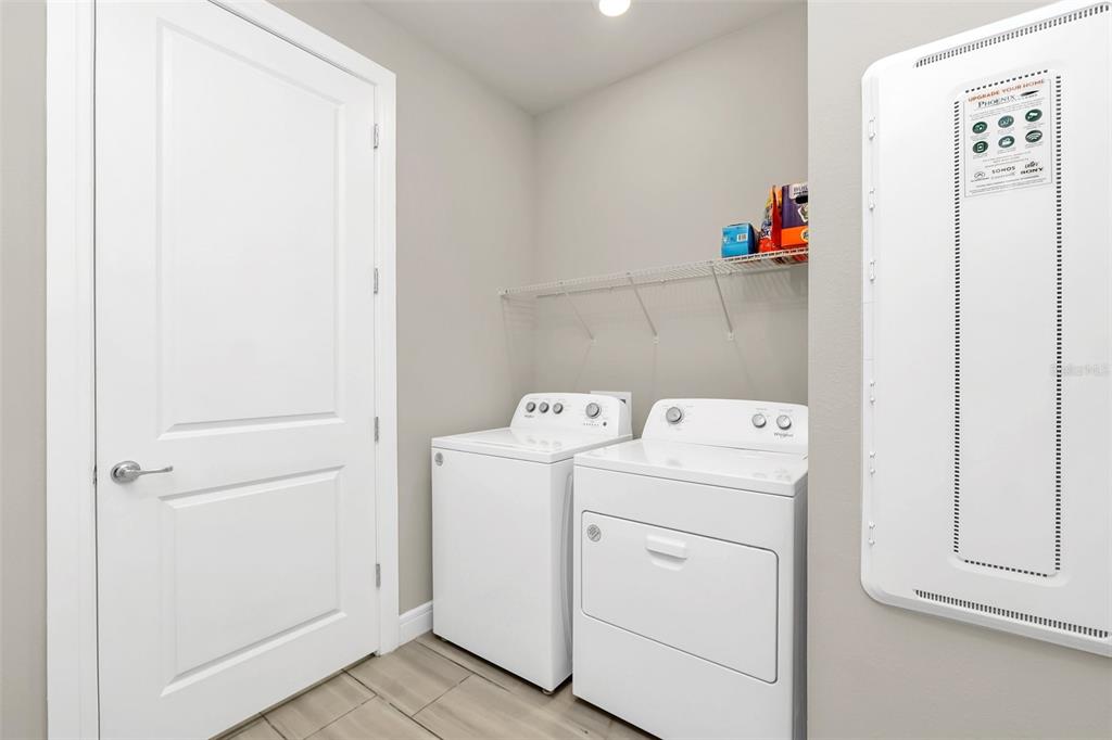 2001 Spring Shower Circle Kissimmee, FL 34744 - Photo 22 of 25 a view of storage and utility room with washer and dryer
