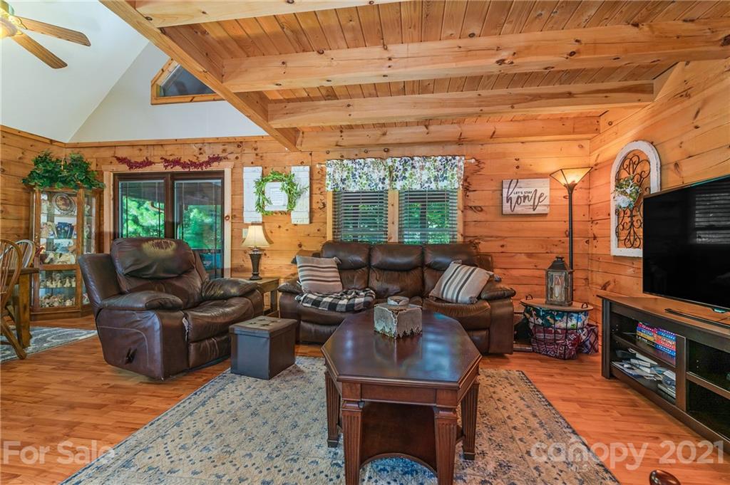 968 Cross Ridge Drive Rutherfordton, NC 28139 - Photo 13 of 39 a living room with furniture a flat screen tv and floor to ceiling window