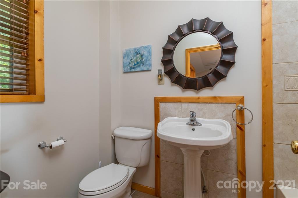 968 Cross Ridge Drive Rutherfordton, NC 28139 - Photo 18 of 39 a bathroom with a toilet sink and mirror