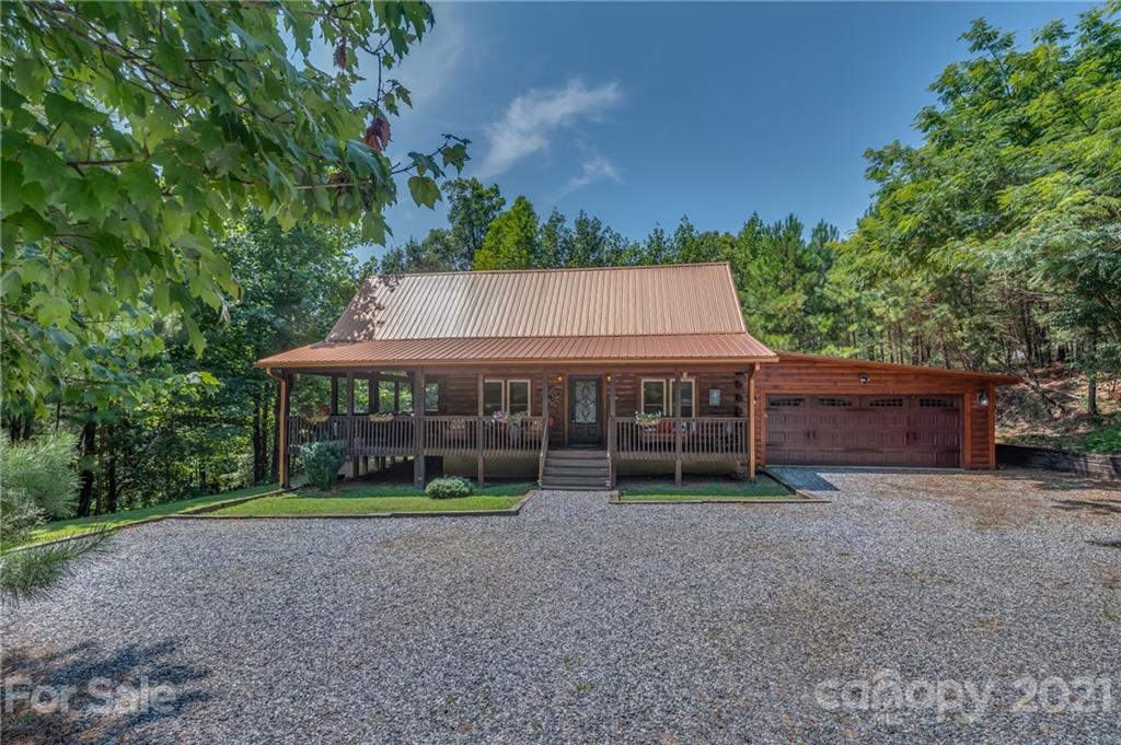 968 Cross Ridge Drive Rutherfordton, NC 28139 - Photo 20 of 39 a view of a house with a yard and large trees