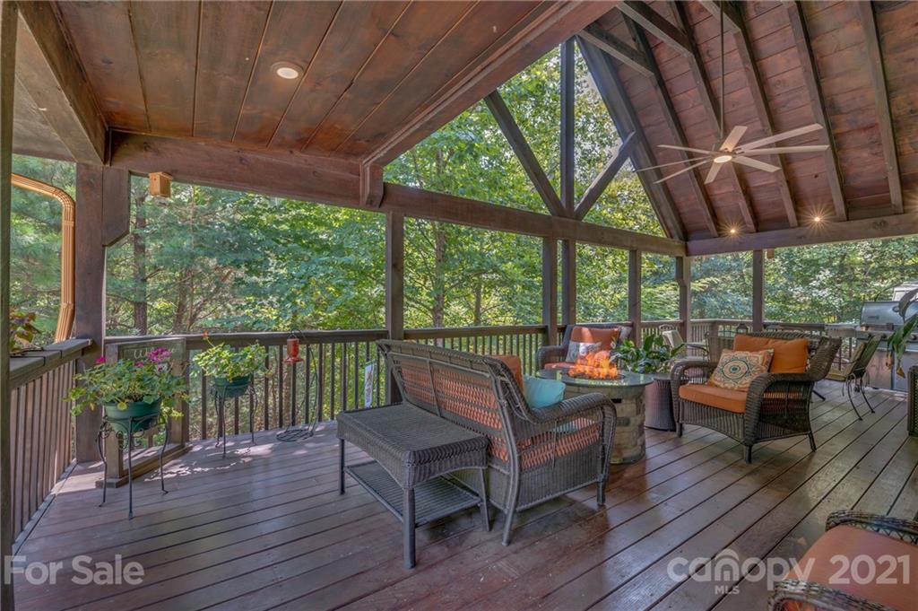 968 Cross Ridge Drive Rutherfordton, NC 28139 - Photo 25 of 39 a balcony with wooden floor and outdoor seating