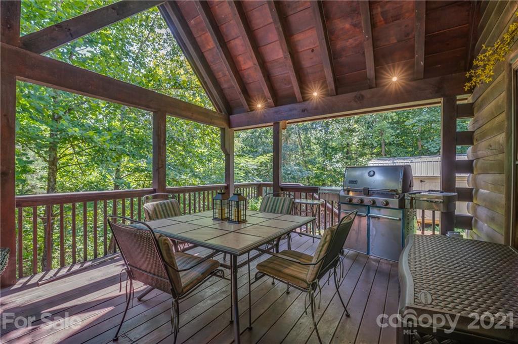 968 Cross Ridge Drive Rutherfordton, NC 28139 - Photo 28 of 39 a view of a patio with a table chairs and a backyard