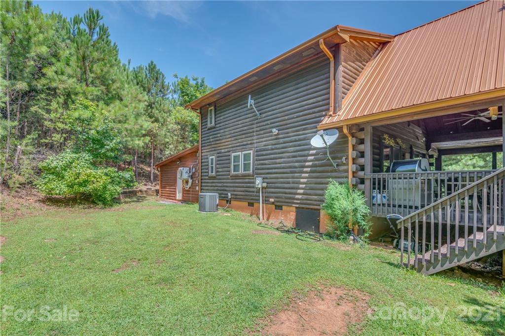 968 Cross Ridge Drive Rutherfordton, NC 28139 - Photo 29 of 39 a view of a house with a yard and deck
