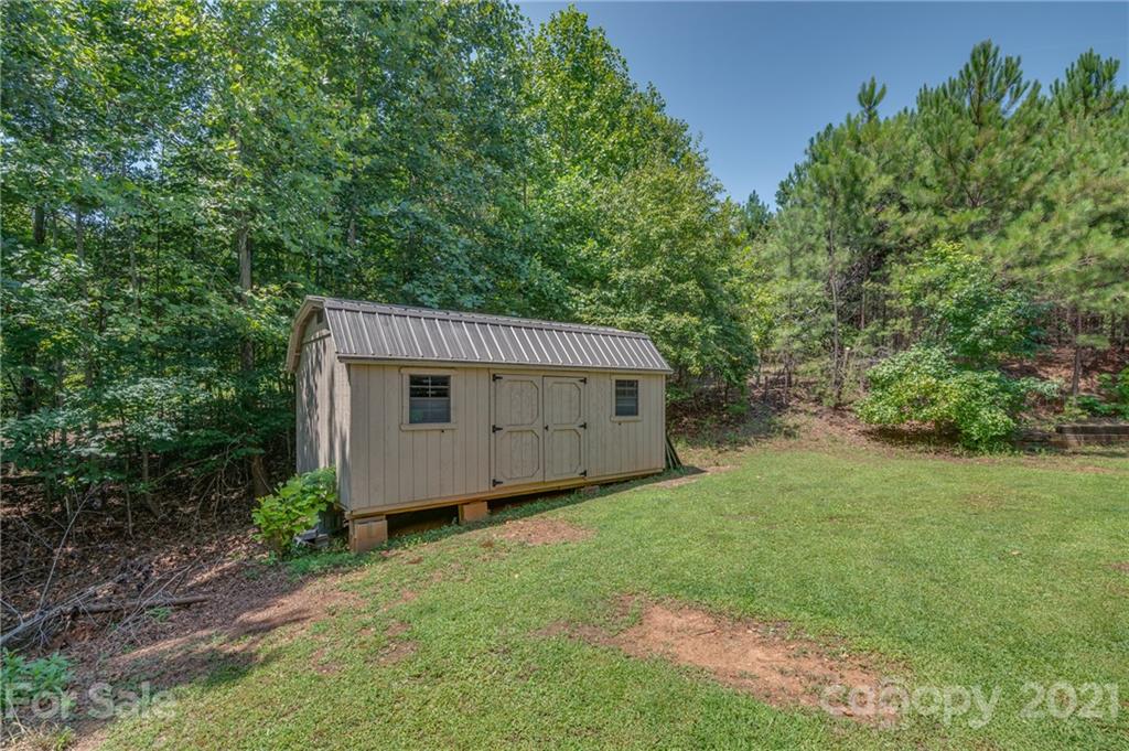 968 Cross Ridge Drive Rutherfordton, NC 28139 - Photo 31 of 39 a view of a barn in the middle of a yard