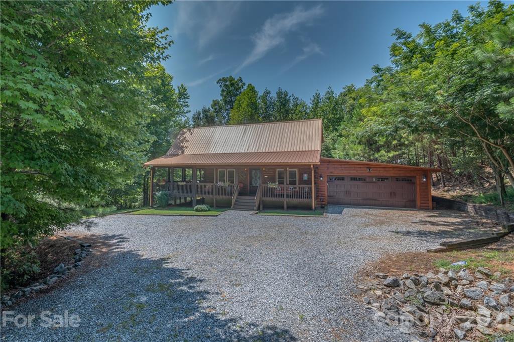 968 Cross Ridge Drive Rutherfordton, NC 28139 - Photo 32 of 39 a wooden house with trees in front of it
