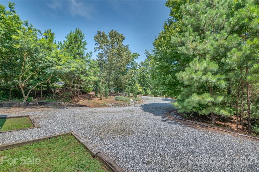 968 Cross Ridge Drive Rutherfordton, NC 28139 - Photo 33 of 39 a view of a yard with a tree