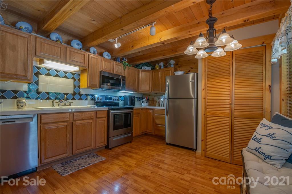 968 Cross Ridge Drive Rutherfordton, NC 28139 - Photo 5 of 39 a kitchen with stainless steel appliances granite countertop a refrigerator and a sink