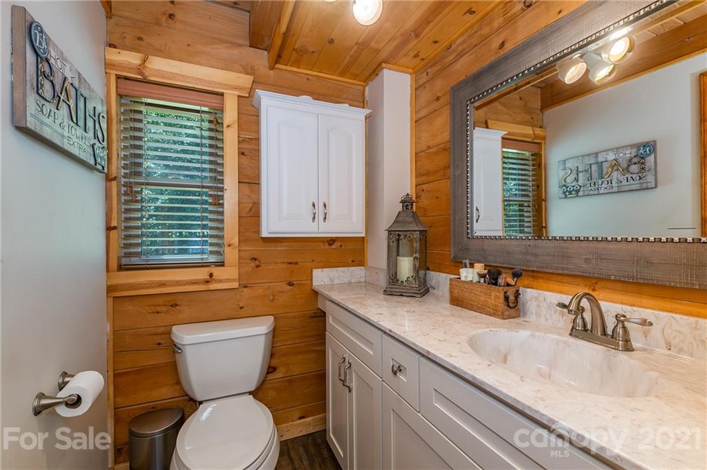 968 Cross Ridge Drive Rutherfordton, NC 28139 - Photo 9 of 39 a bathroom with a granite countertop toilet sink and mirror