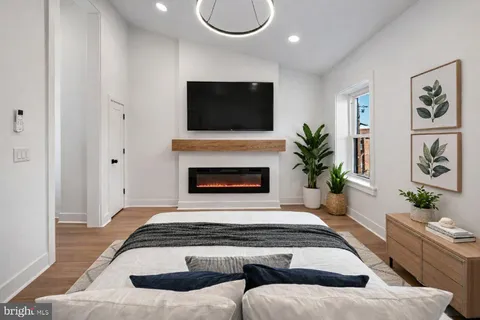 a living room with furniture fireplace and flat screen tv