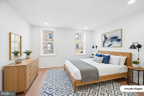 a bedroom with double bed and a window