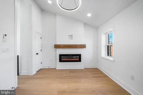 a view of an empty room with a fireplace