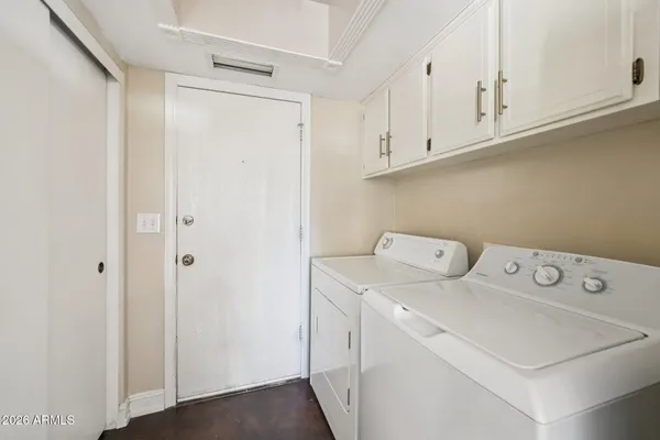 a bathroom with a bathtub a window and a shower