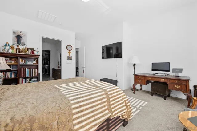 a spacious bathroom with a double vanity sink and a mirror