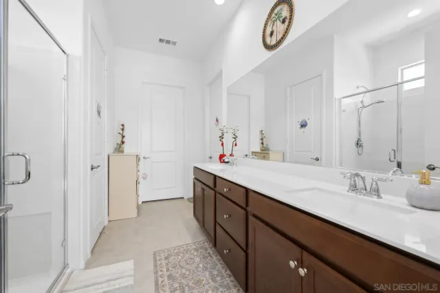 a bathroom with a bathtub and shower