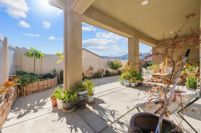 a lobby with furniture and floor to ceiling window