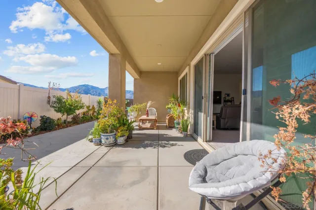 a lobby with furniture and a potted plant
