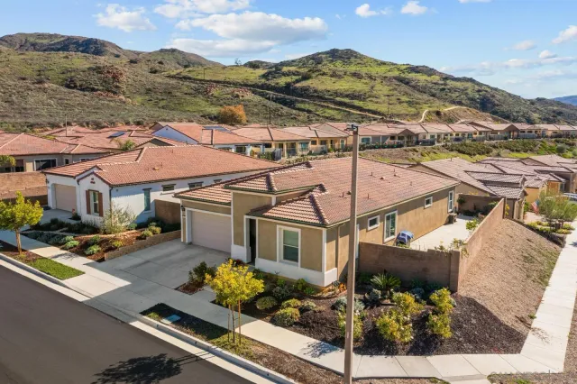 an aerial view of houses with yard