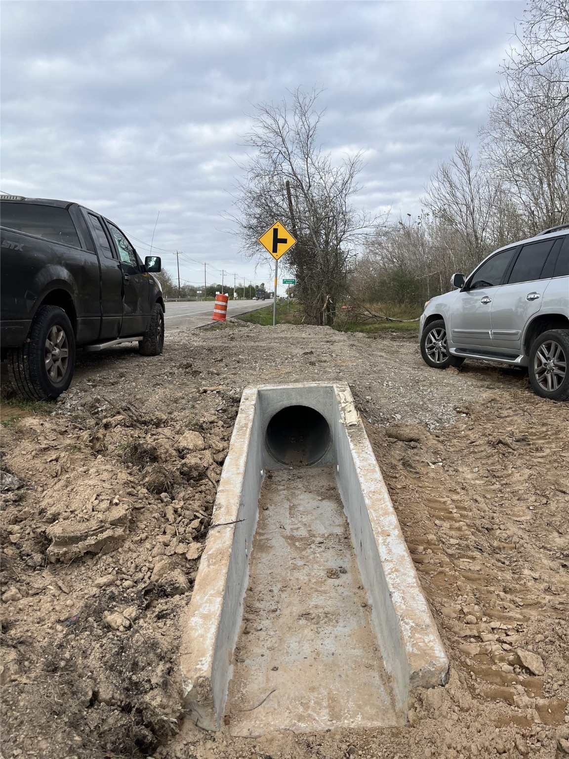 a view of outdoor space with parked cars