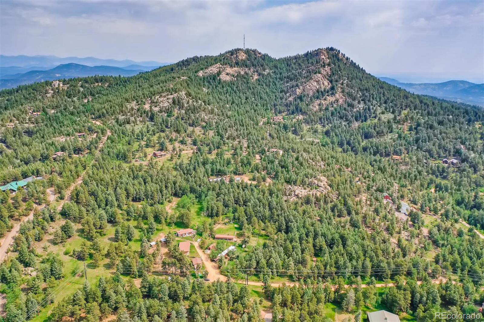 8939 South Hillview Road Morrison, CO 80465 - Photo 11 of 39 a view of a field with a building in the background