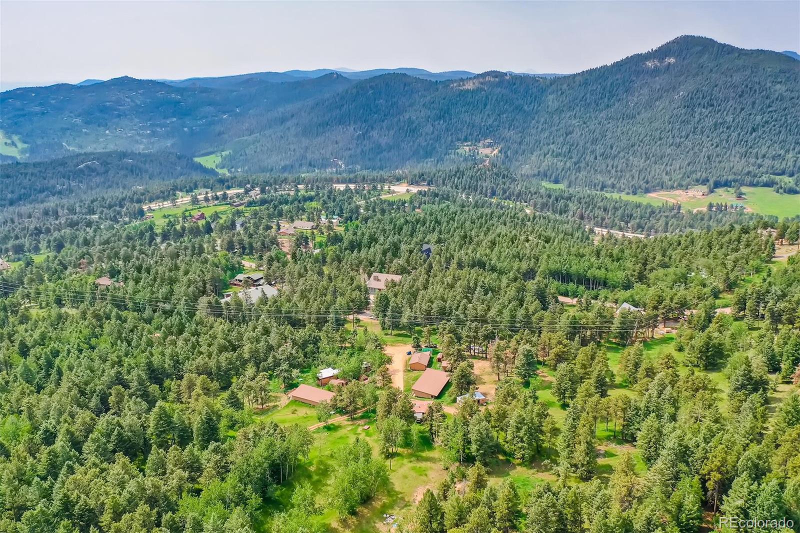 8939 South Hillview Road Morrison, CO 80465 - Photo 8 of 39 a view of a mountain in the distance in a field