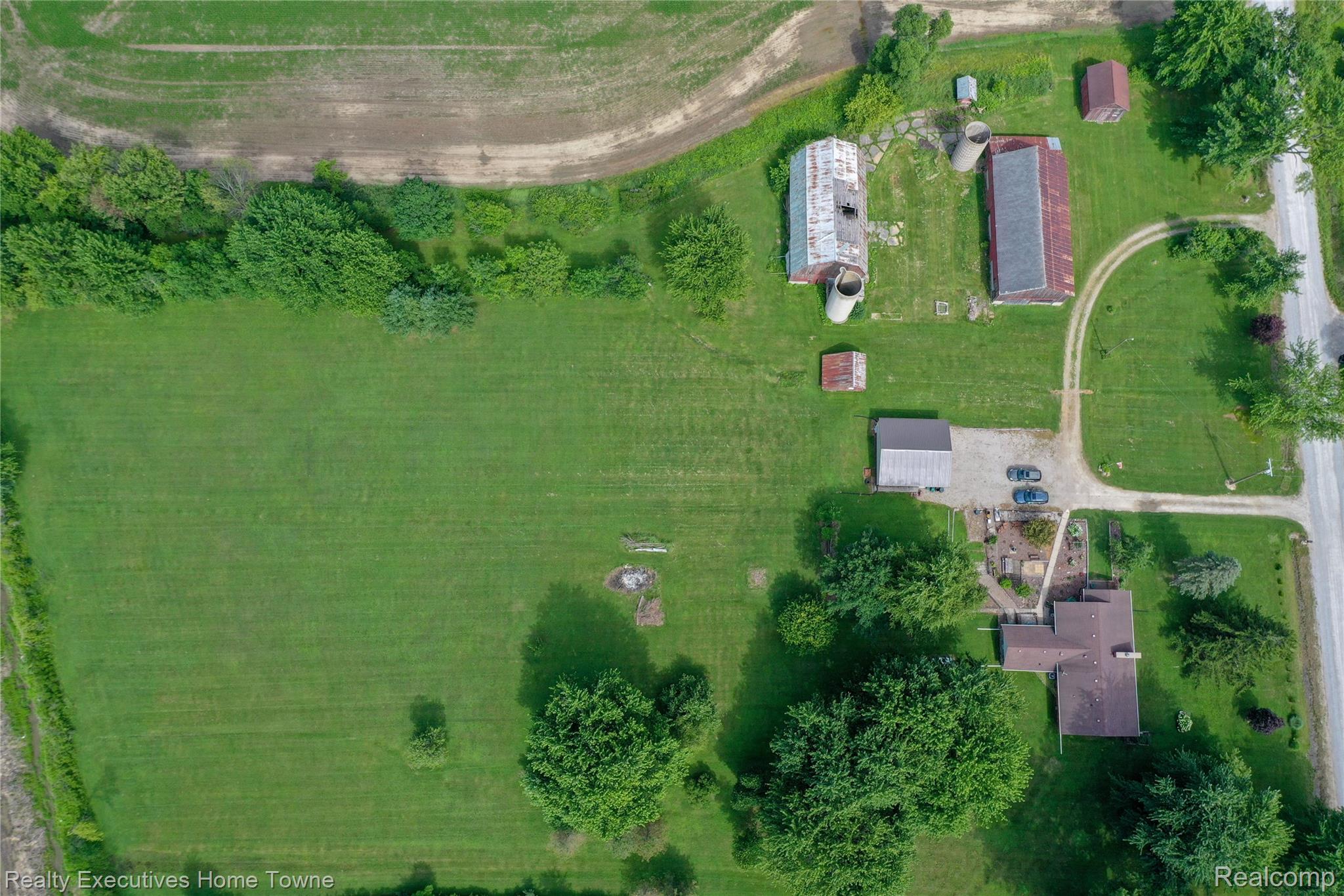 8728 Rynn Road Avoca, MI 48006 - Photo 32 of 53 Expansive rural property featuring a primary residence, multiple outbuildings, and extensive green space