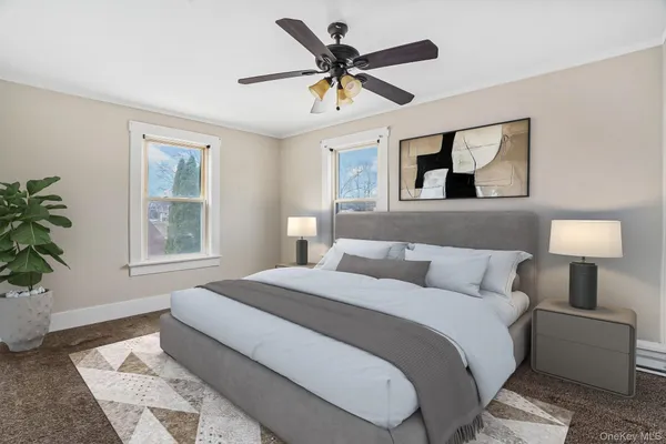 a bedroom with a large bed and a window