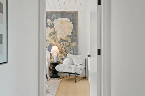 a bathroom with a toilet and shower curtain