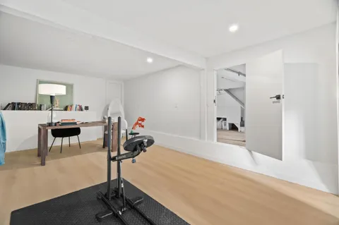 a room with furniture and gym equipment