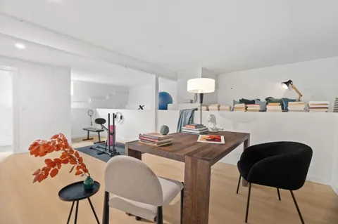 a work room with furniture and a lamp