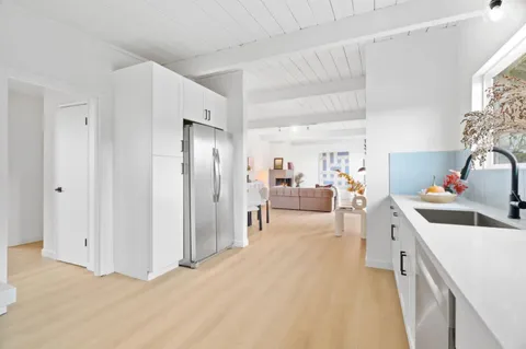 a view of a living room and a sink